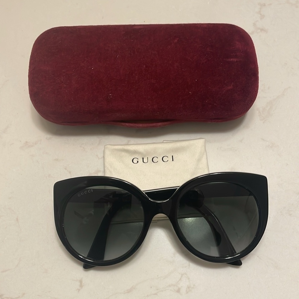 Gucci Cat Eye Black Sunglasses with golden logo temples and a logo on a lense - Picture 3 of 5